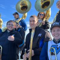 trombone and sousaphone alumni with an LMB trombone player